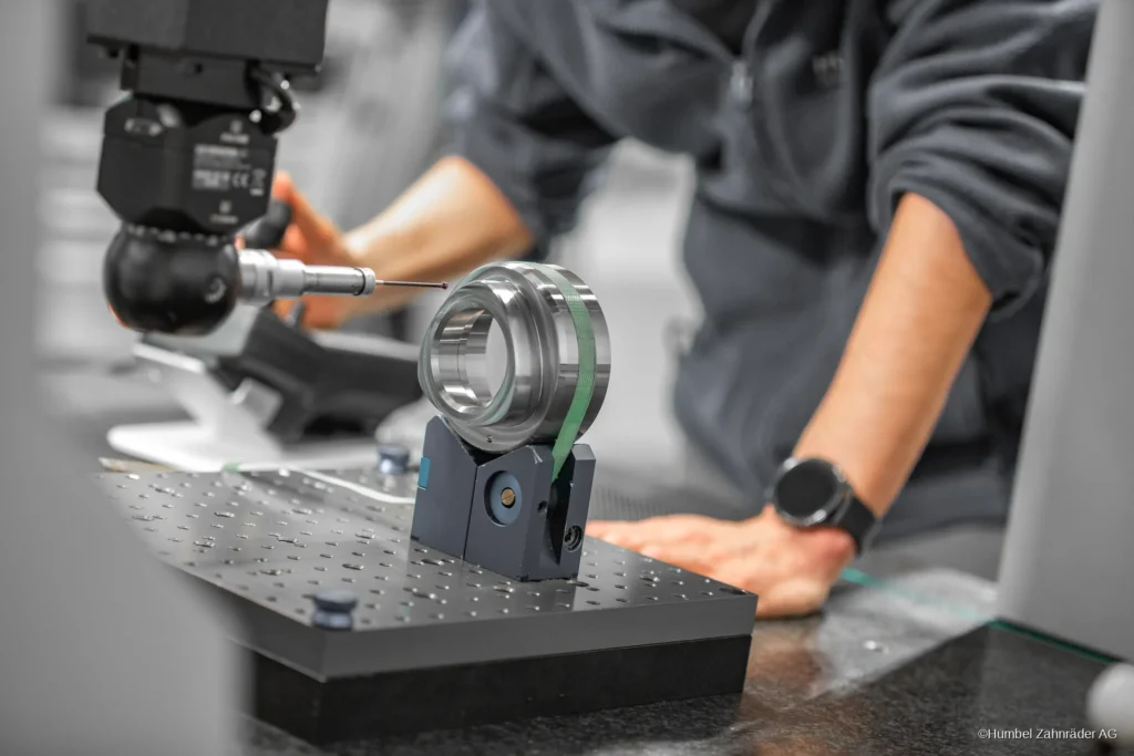 Coordinate measuring machine probing a precision-machined ring at Humbel